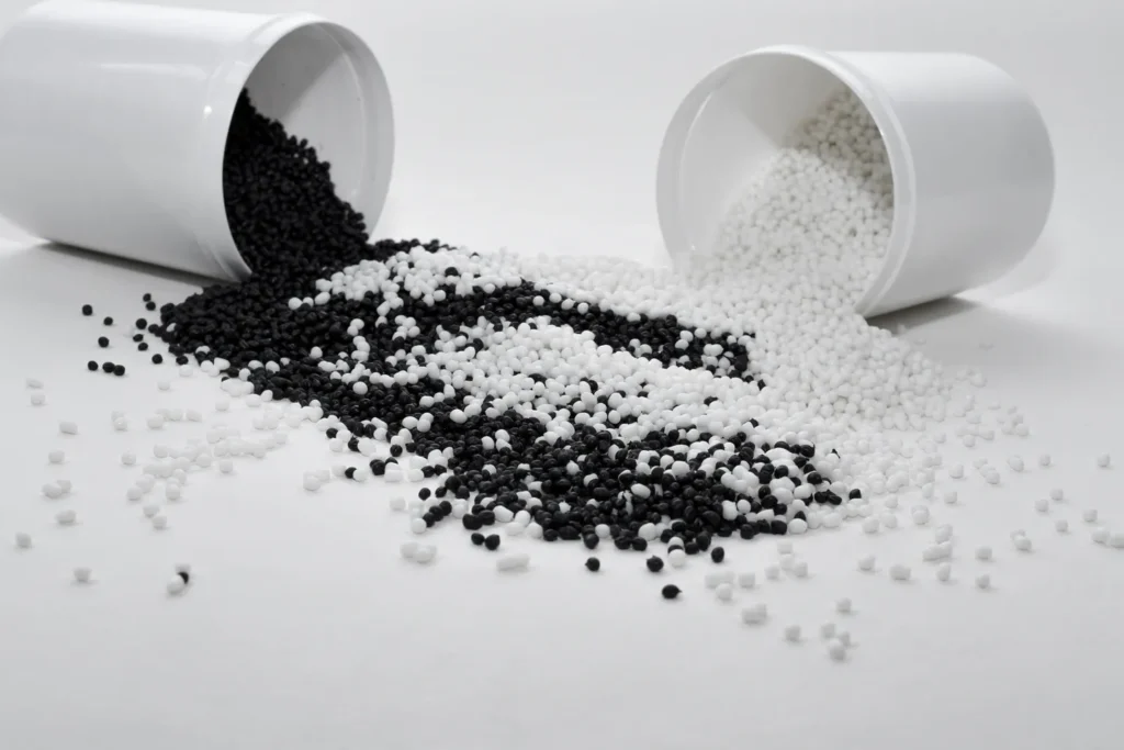 A picture of tiny round black and white items scattered on the surface
